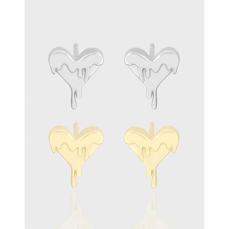 Four heart-shaped stud earrings with a melting drip motif in silver and gold tones