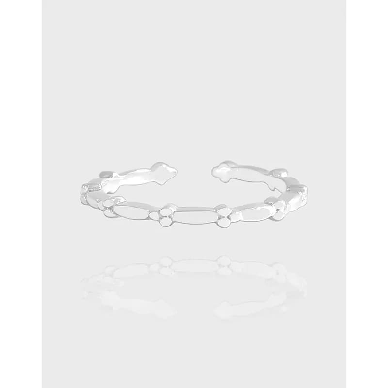 Polished sterling silver ring with linked bead-and-oval segments forming an open, adjustable band.