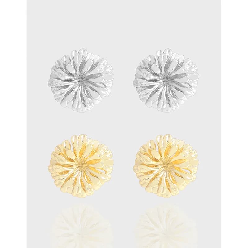 Polished sunburst disc stud earrings in silver and gold-tone versions laid out on a light gray background.