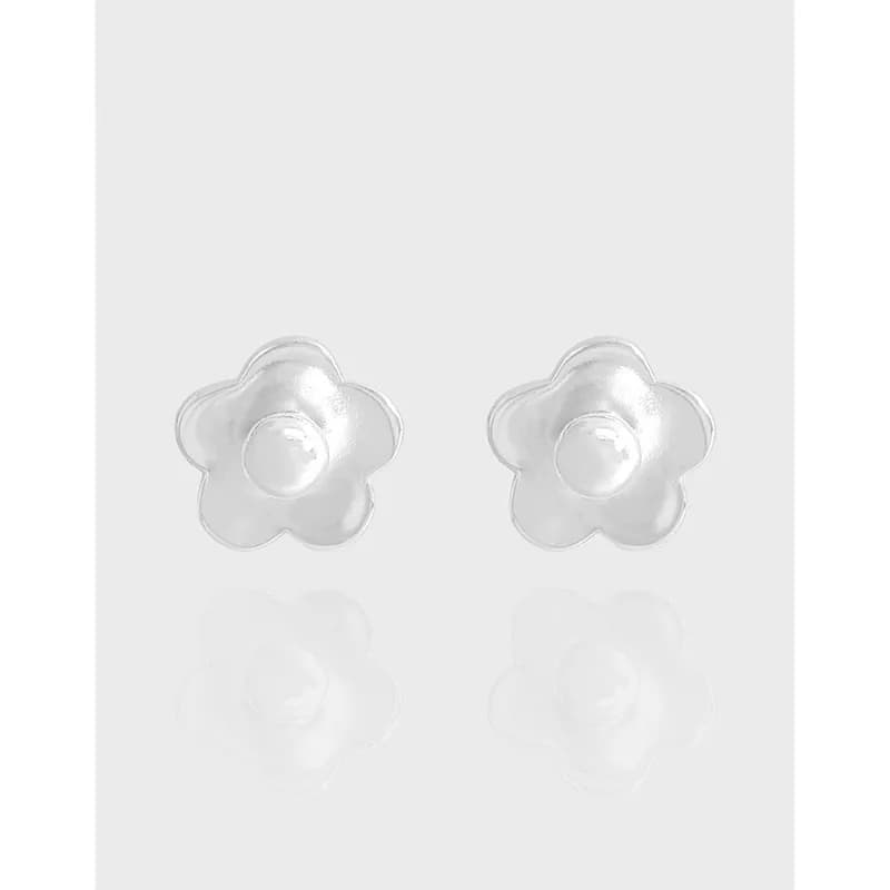 Polished sterling silver flower-shaped stud earrings with a central domed center.