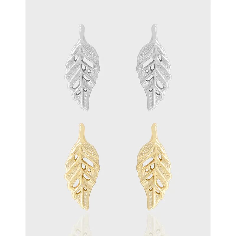 Polished leaf-shaped filigree earrings in silver and gold-tone finishes.