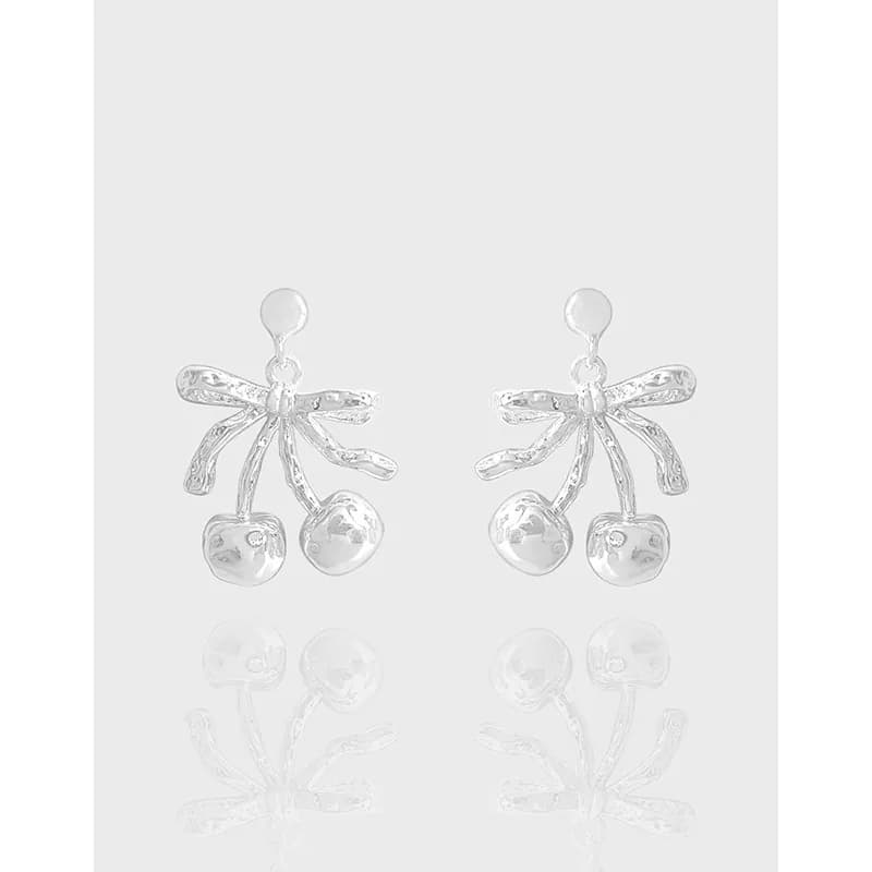 Polished sterling silver cherry-bow earrings with two dangling silver spheres.