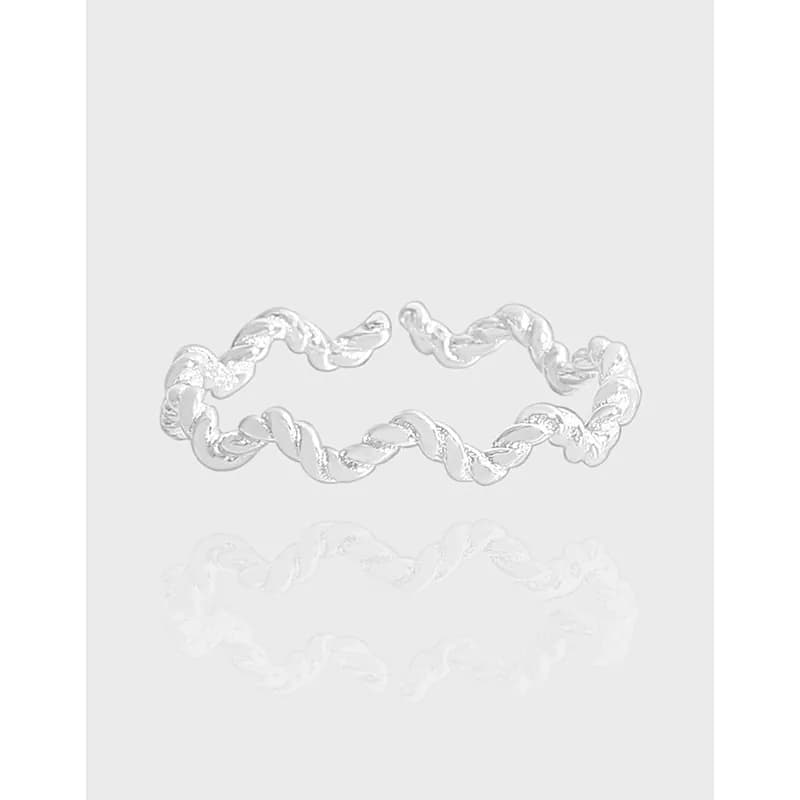 Silver twisted rope ring with a polished finish on a light background.