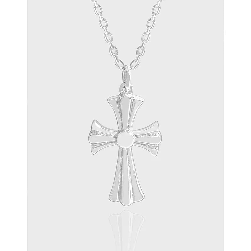 Polished sterling silver cross pendant on a delicate chain