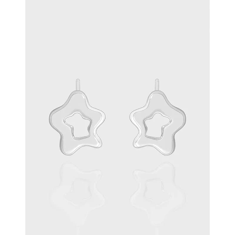 Sterling silver star-outline drop earrings with inner star cutout on hook findings.