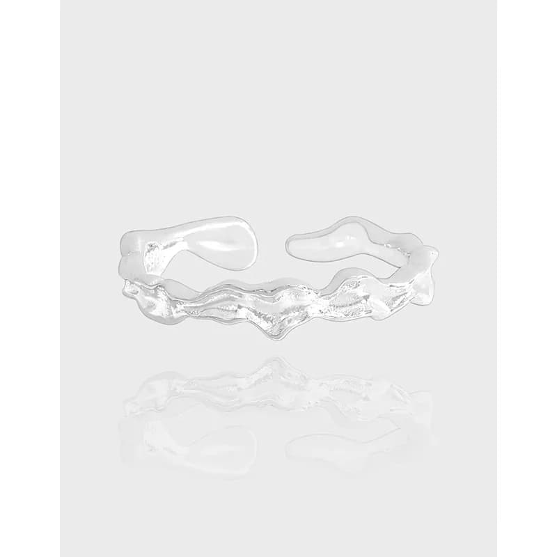 Open-ended wavy sterling silver ring with a polished finish.