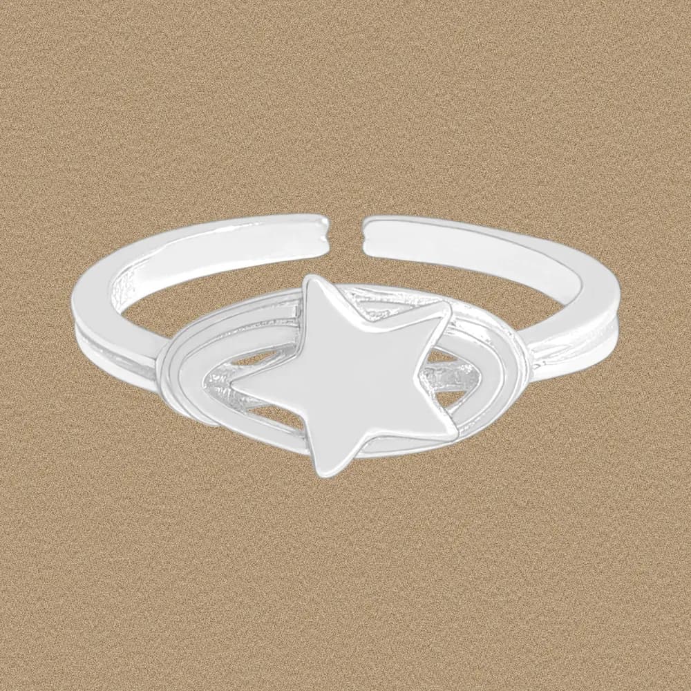 Polished sterling silver ring with a raised star centerpiece inside an oval setting on an open, adjustable band.