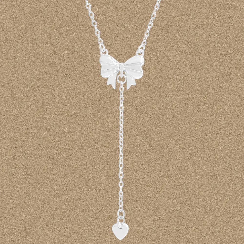 Silver butterfly pendant necklace with a Y-shaped drop ending in a small heart charm.