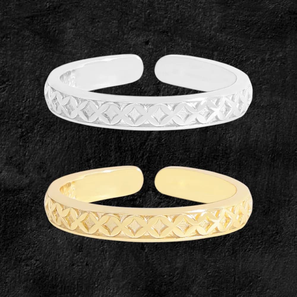 Polished sterling silver ring with a raised lattice pattern along the band.