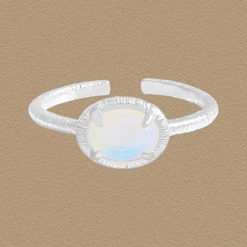 Sterling silver Opal Oval Ring with textured band and four-prong oval opal centerpiece.