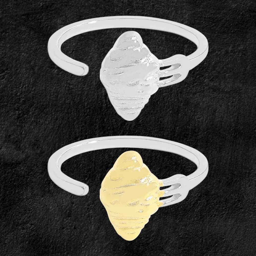 Polished sterling silver ring with an open band and a textured shell centerpiece