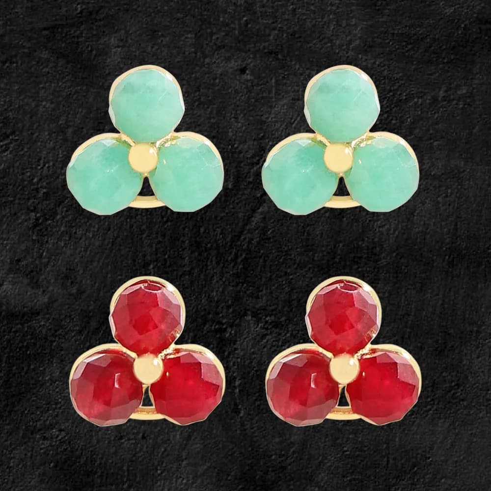 Pair of clover-shaped stud earrings with three enamel-green or enamel-red petals surrounding a gold center.