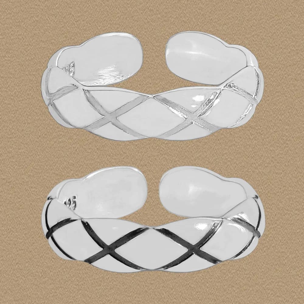 Polished sterling silver crisscross lattice open cuff ring shown from two angles.
