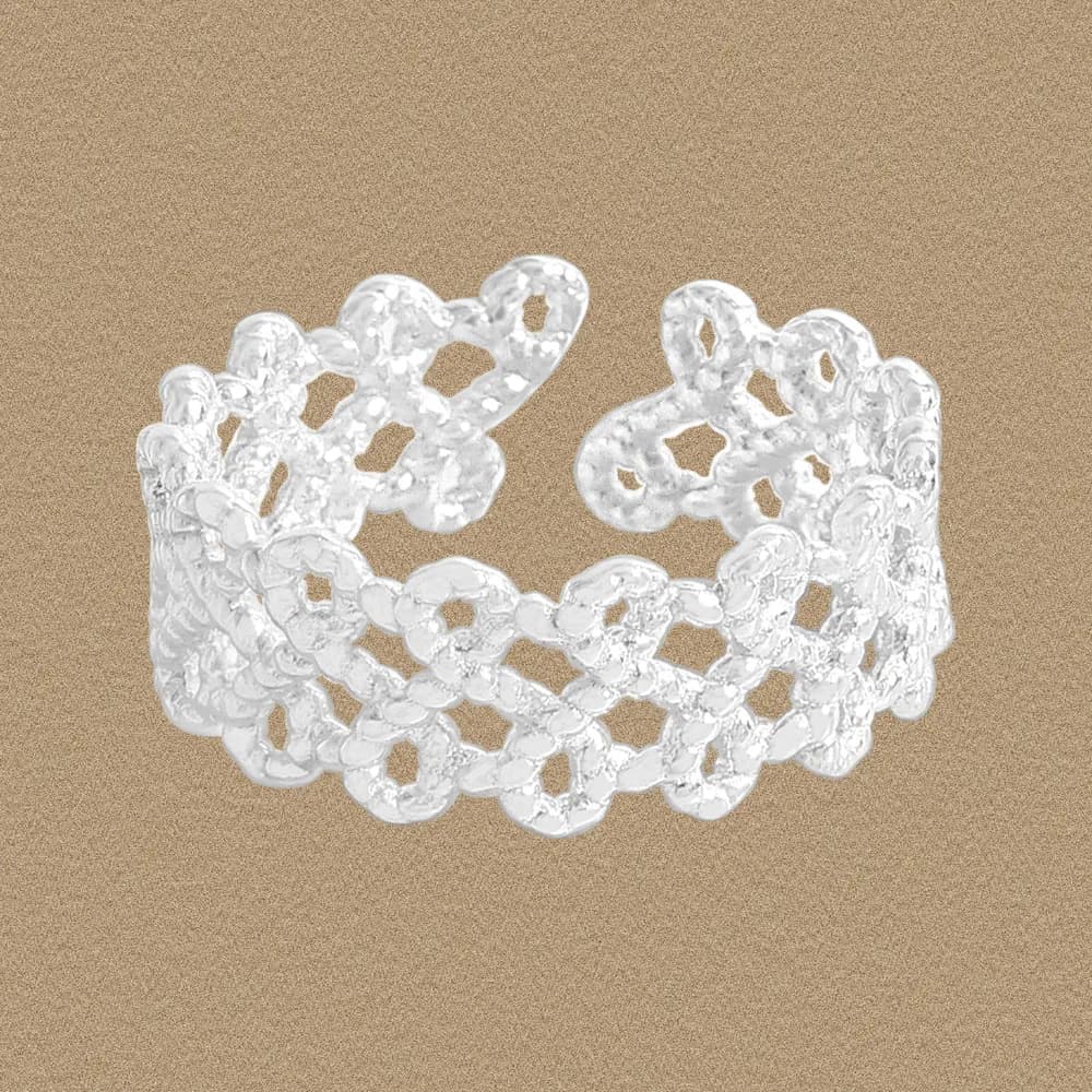 Wide sterling silver ring with interconnected circular floral links forming an open lattice design.