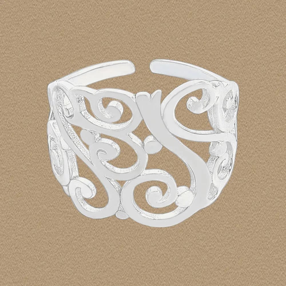 Sterling silver filigree ring with swirling vine patterns and openwork design