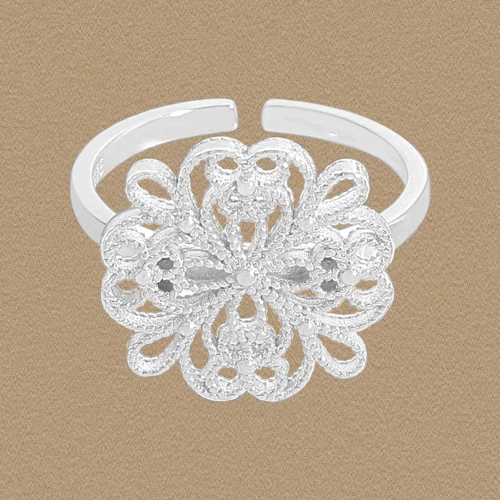 Polished sterling silver filigree flower ring with an openwork blossom centerpiece