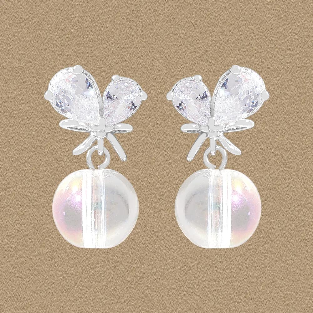 Sterling silver butterfly earrings with iridescent pearl drops hanging from the wings.