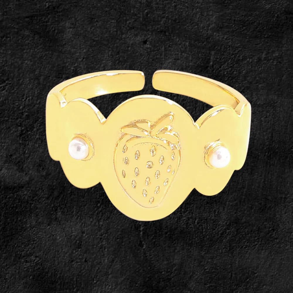 Gold-tone strawberry motif ring with open cuff design and small bead accents.