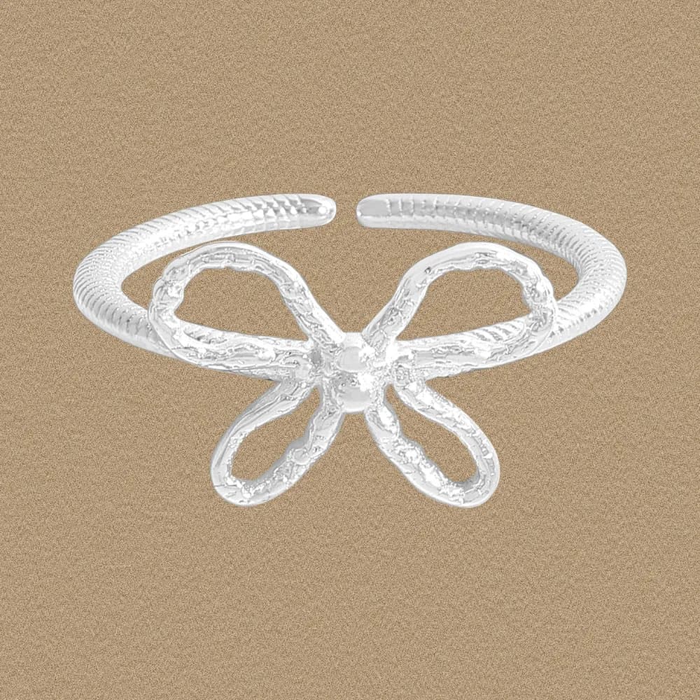Polished sterling silver Bow Knot Ring with a textured center bow on an open band.