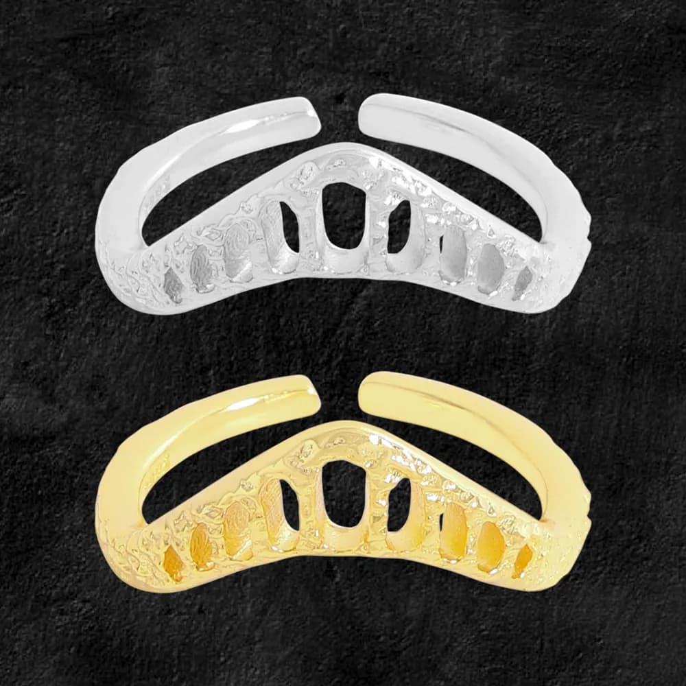 Polished sterling silver ring with a curved band and open lattice cutouts across the top.