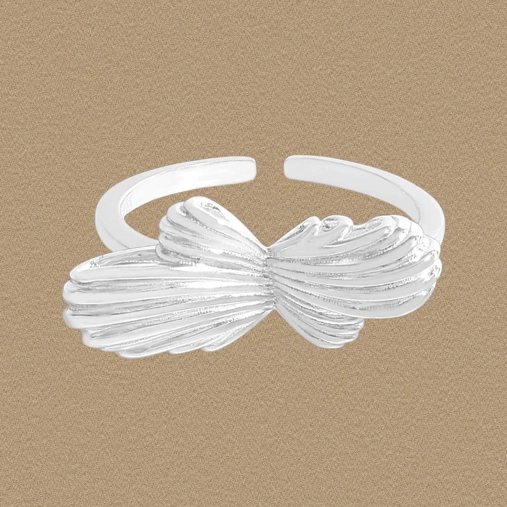 Open-band sterling silver ring with a ribbed bow knot centerpiece.