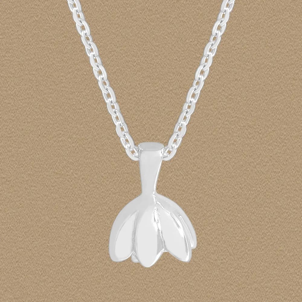 Polished sterling silver petal-shaped pendant on a curb-chain necklace