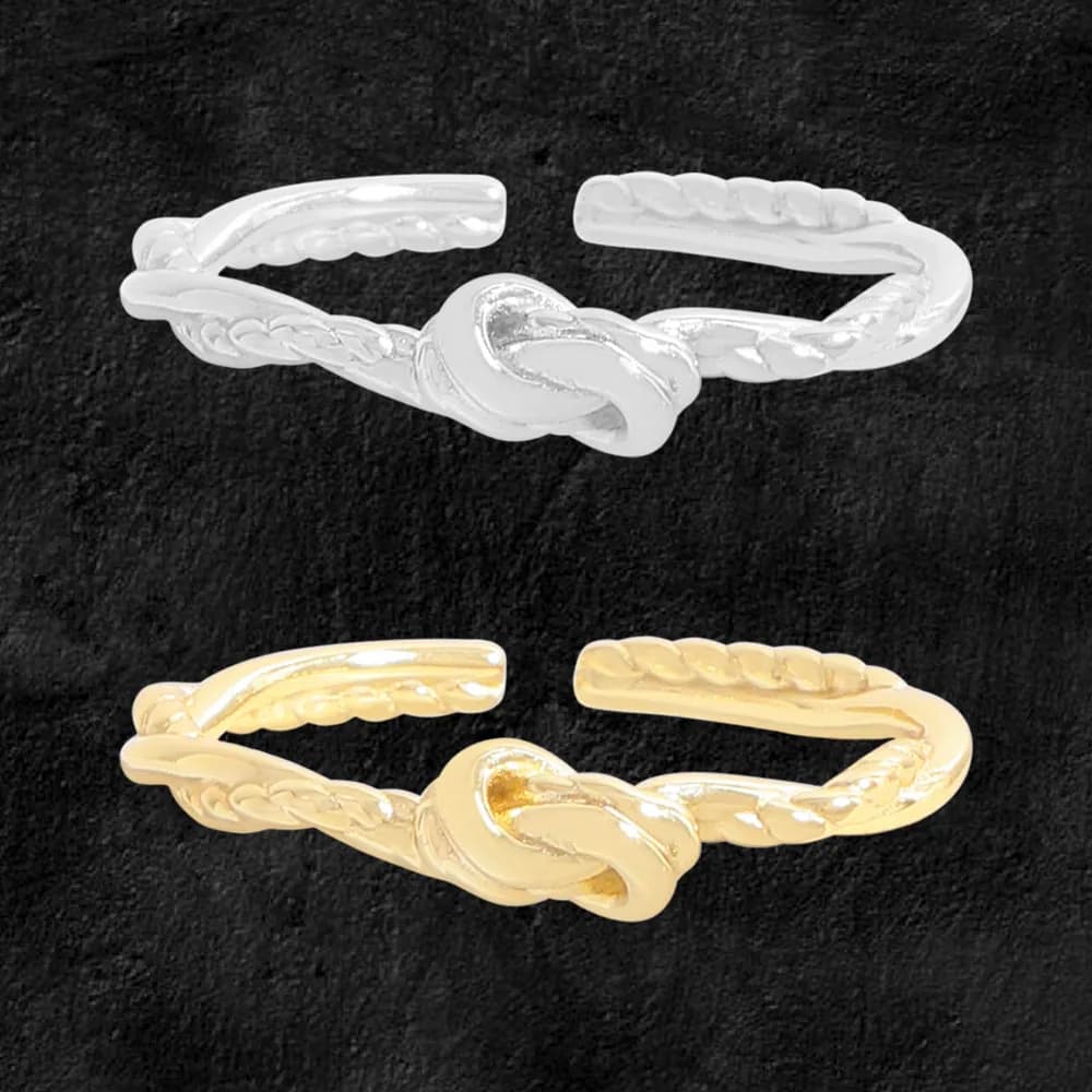 Polished sterling silver knot ring with braided twisted bands and a central knot.
