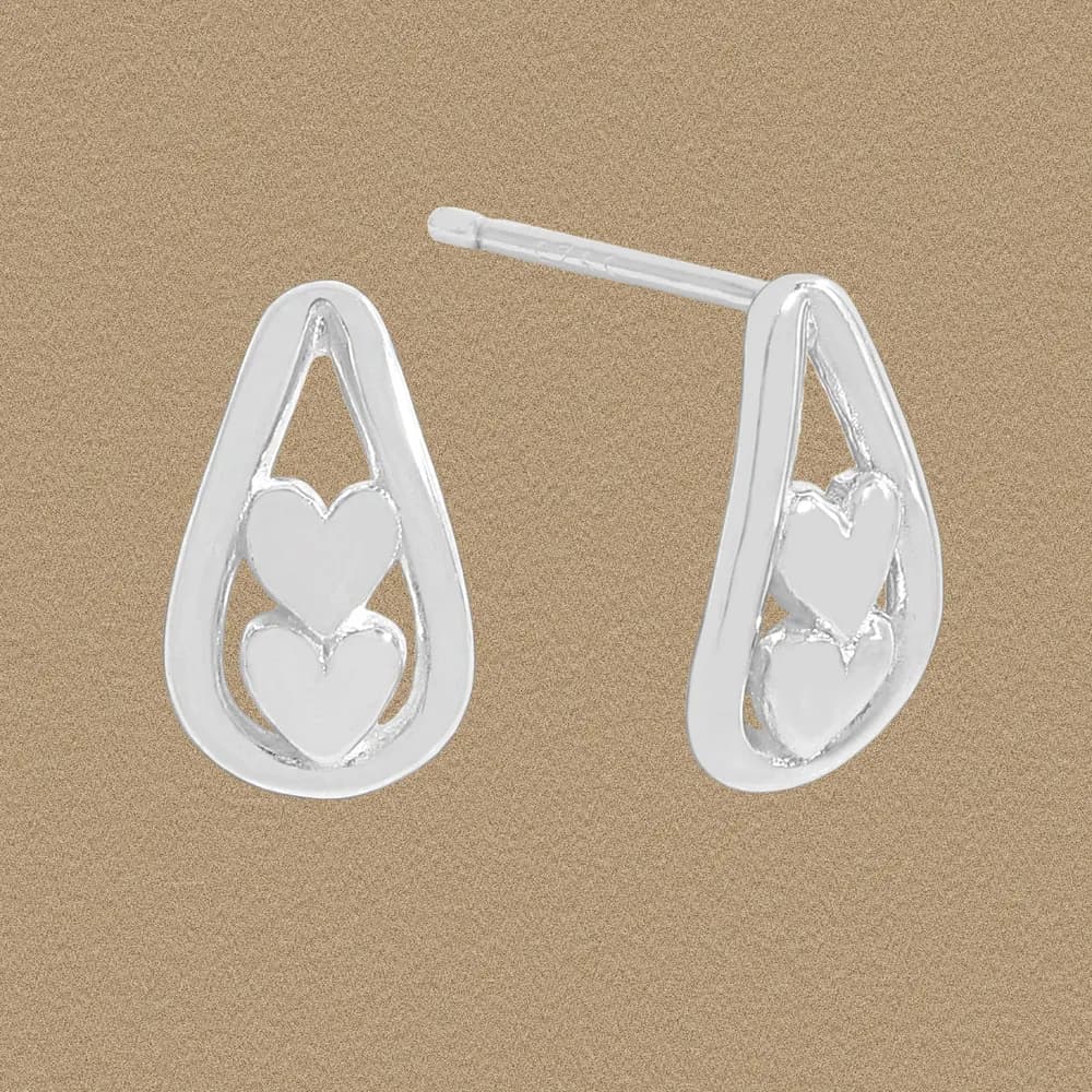 Sterling silver teardrop earrings with two open-heart motifs inside a polished frame.