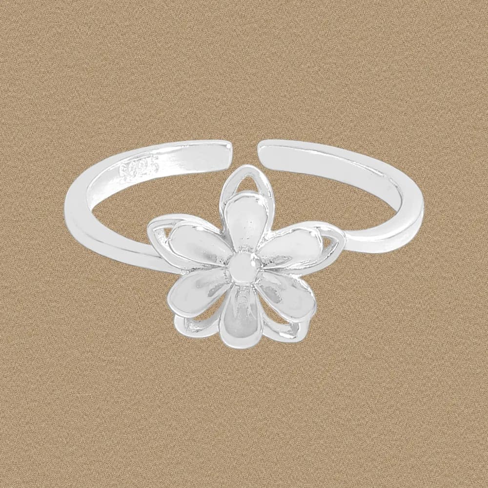 Polished sterling silver ring with a flower centerpiece on an open band.