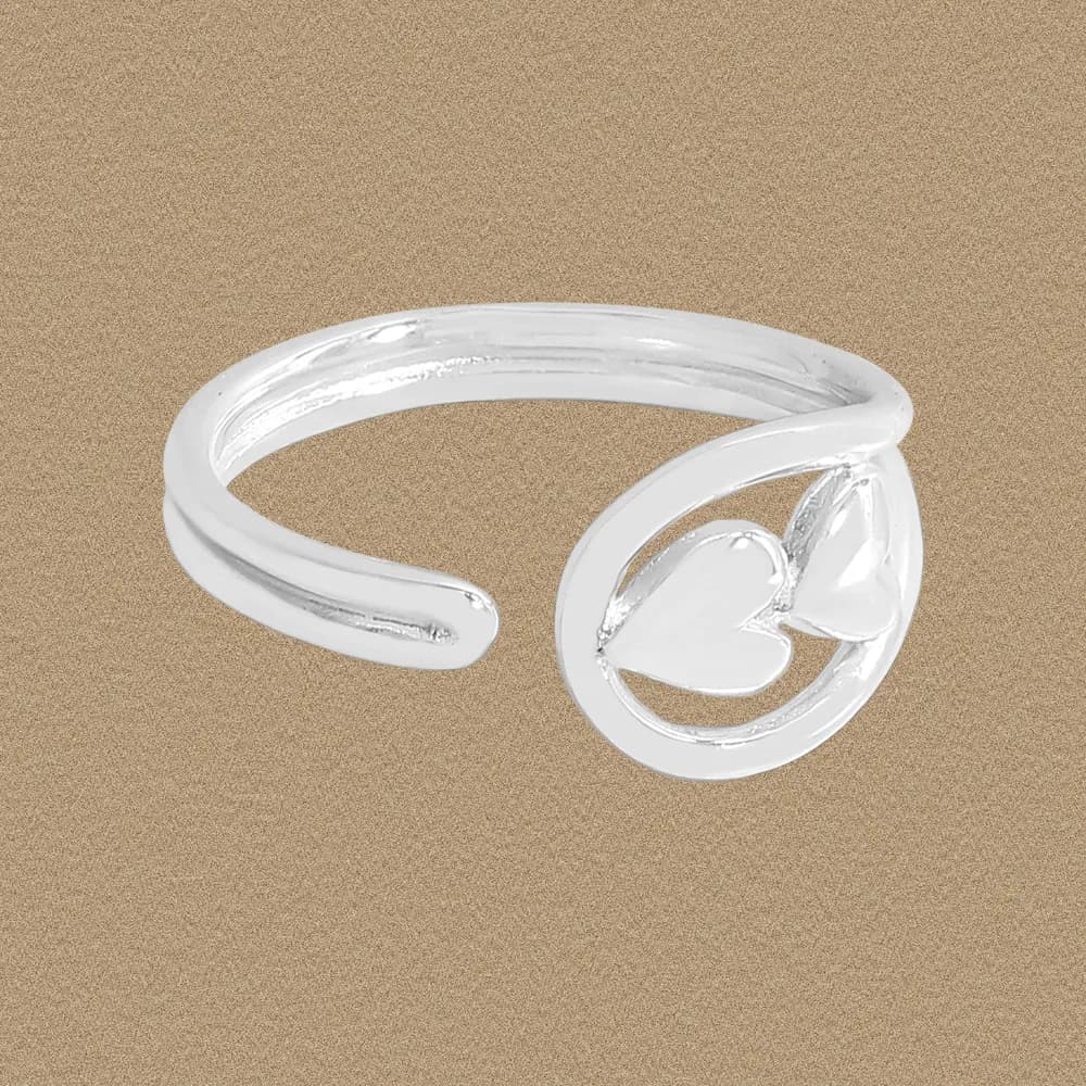 Polished sterling silver open ring featuring a circular hoop with two small hearts at the front.