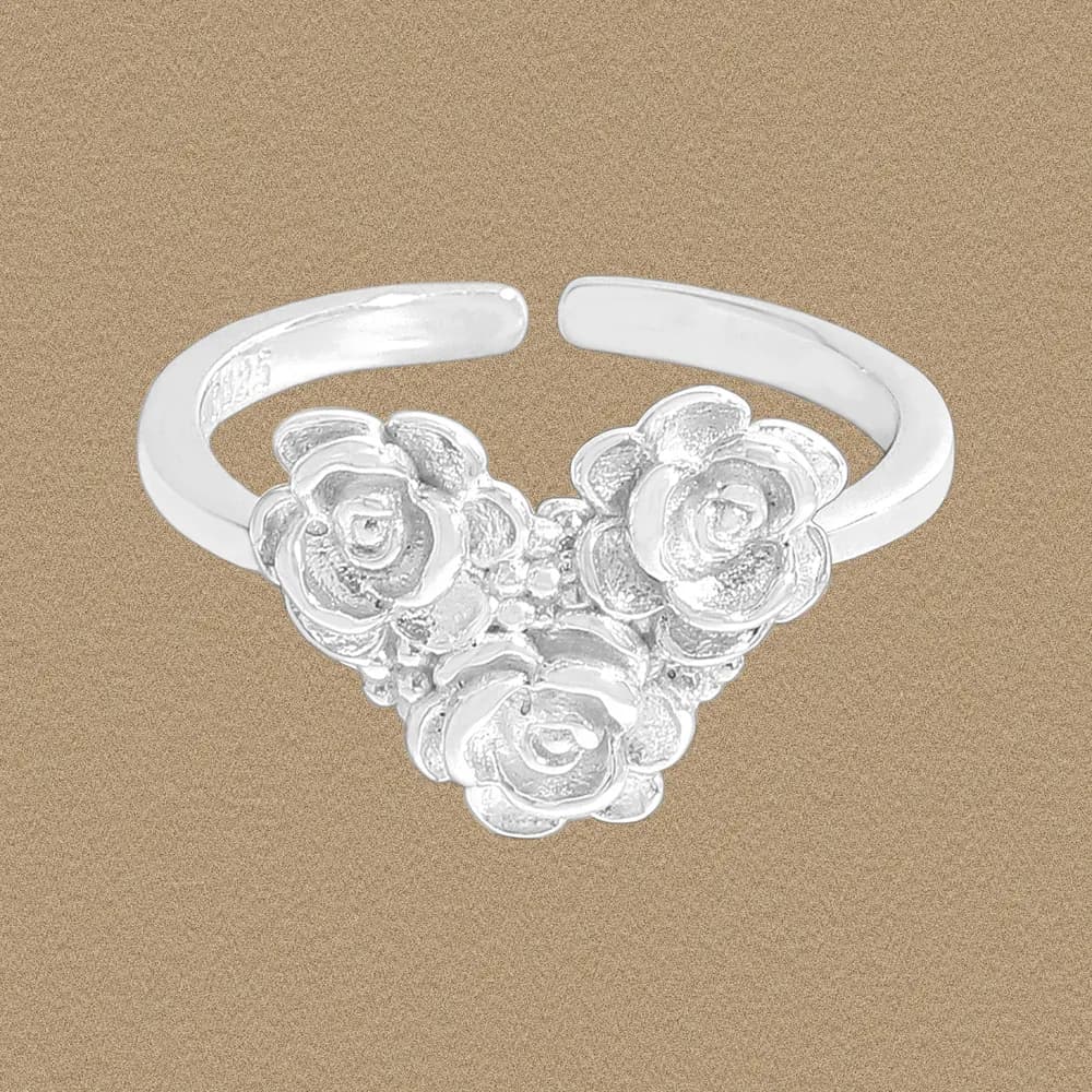 Polished sterling silver ring with a cluster of mini roses forming a bouquet centerpiece.