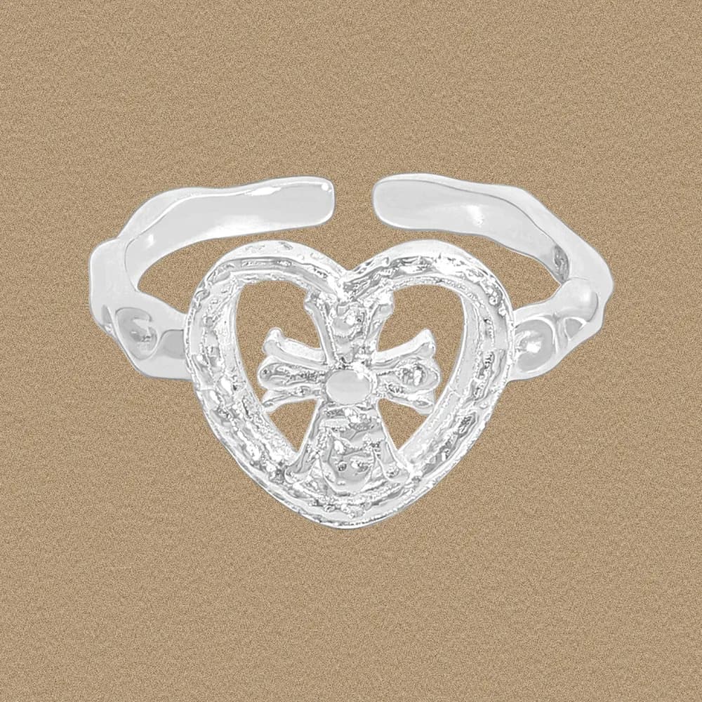 Polished sterling silver heart-shaped ring with an open center and bow detail