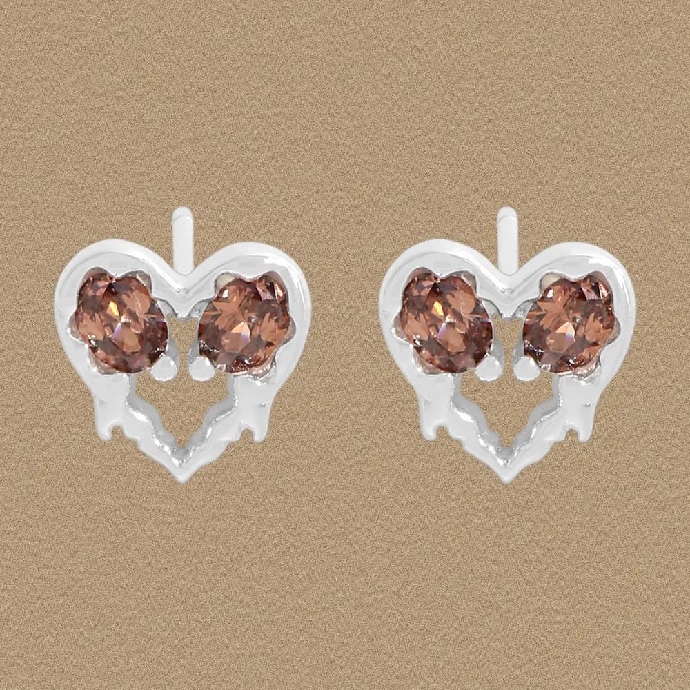 Pair of heart-shaped sterling silver stud earrings with two pink-brown faceted stones set side by side.