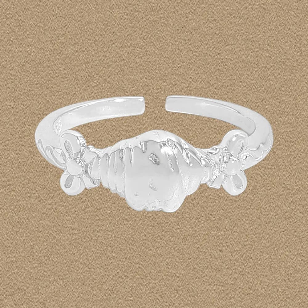 Polished sterling silver Shell Bead Ring with floral accents on each side, shown on a neutral background.