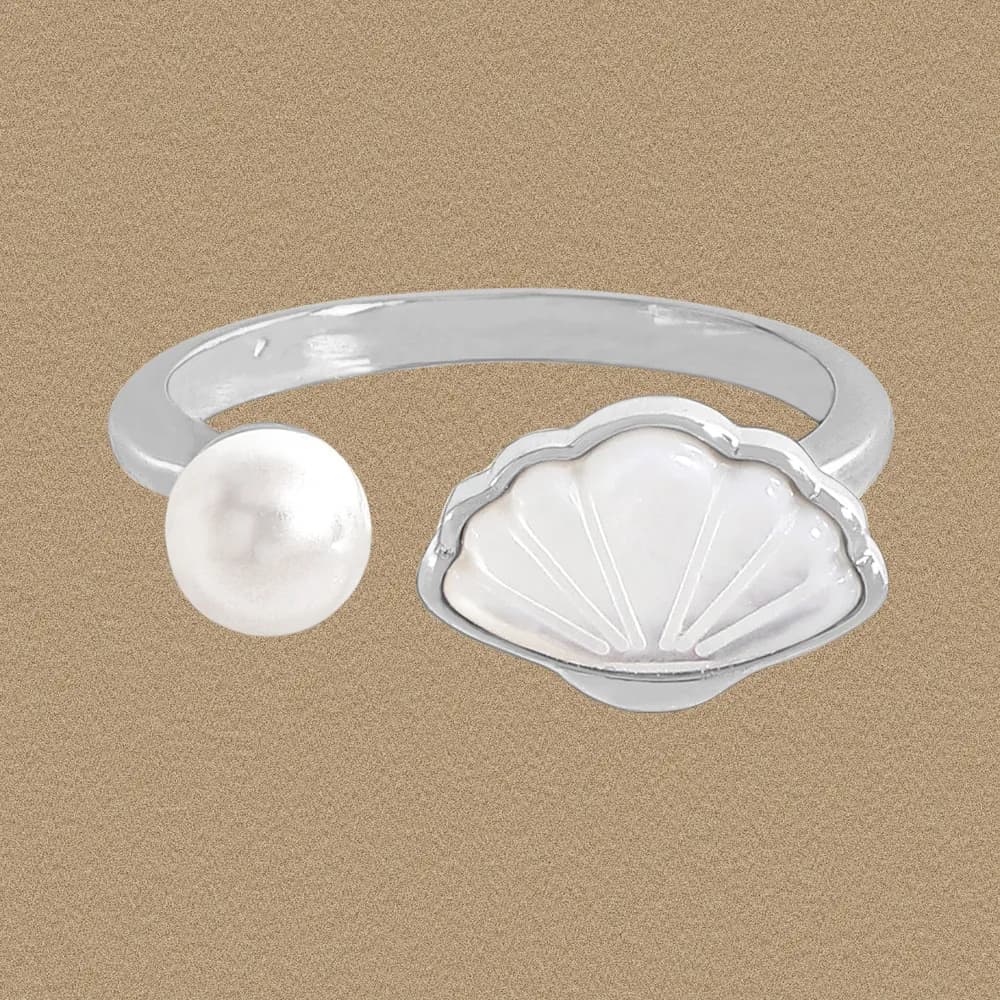 Open-ended sterling silver ring featuring a pearl bead on one end and a scallop shell motif on the other.