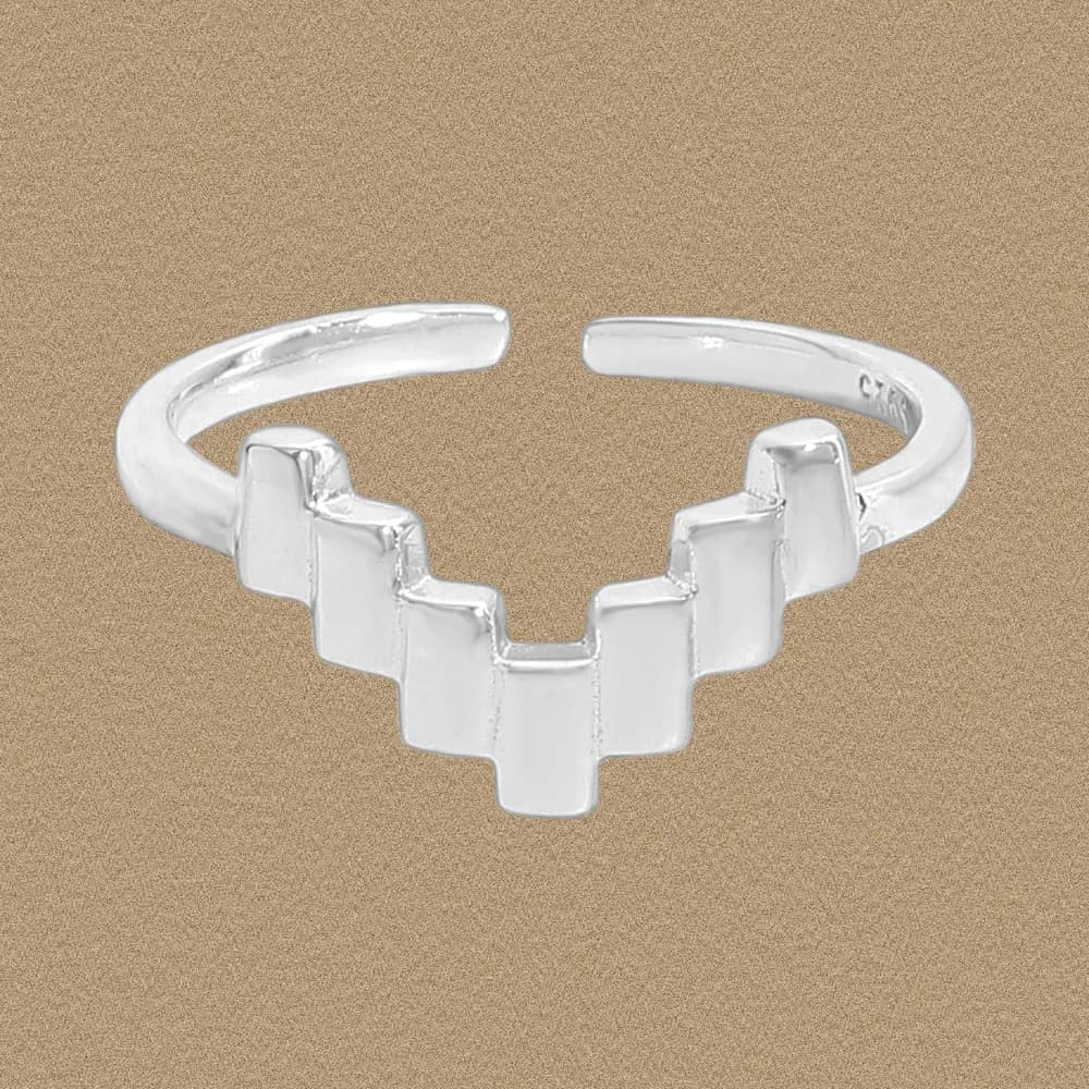 Polished Sterling Silver open-ring with a stepped staircase front design on a tan background.