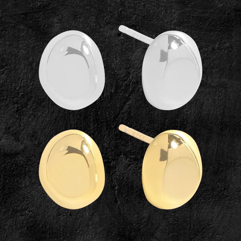 Polished oval domed disc earrings in silver and gold-tone finishes with convex surfaces and posts