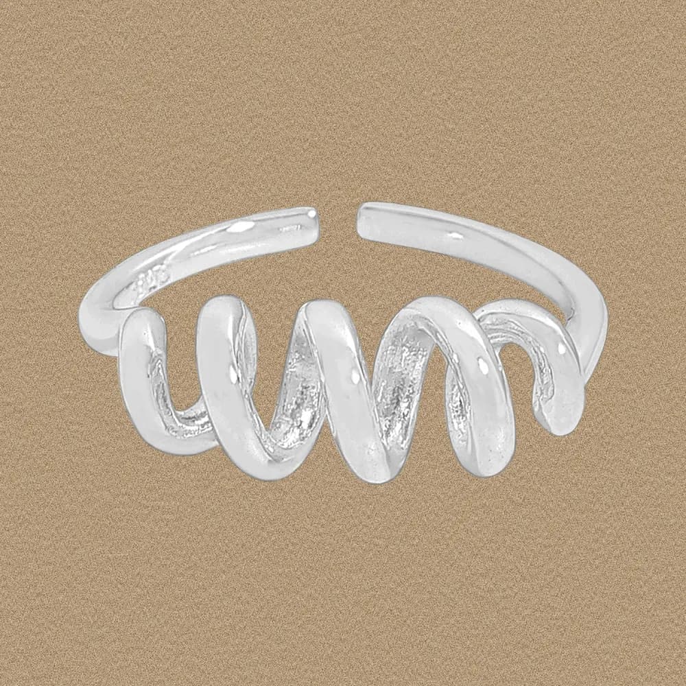 Polished sterling silver spiral coil ring displayed on a warm beige background.