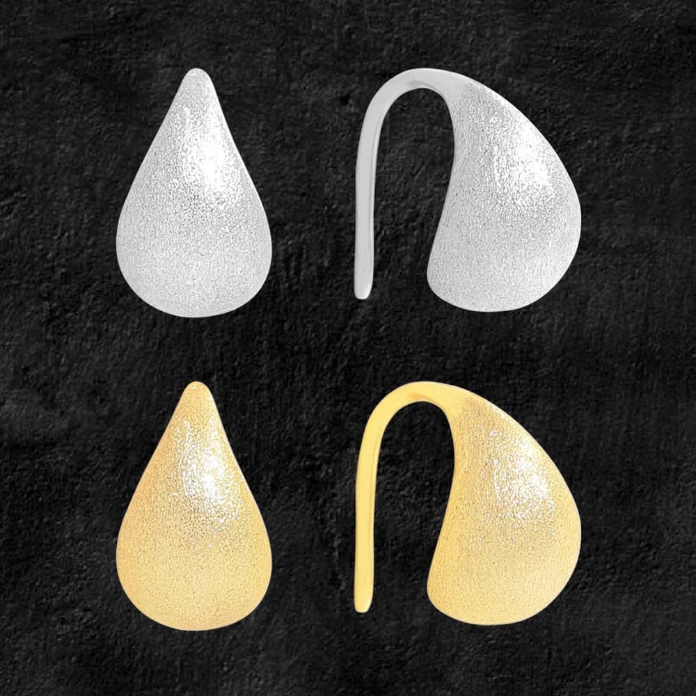 Pair of textured teardrop-shaped sterling silver earrings with curved hooks