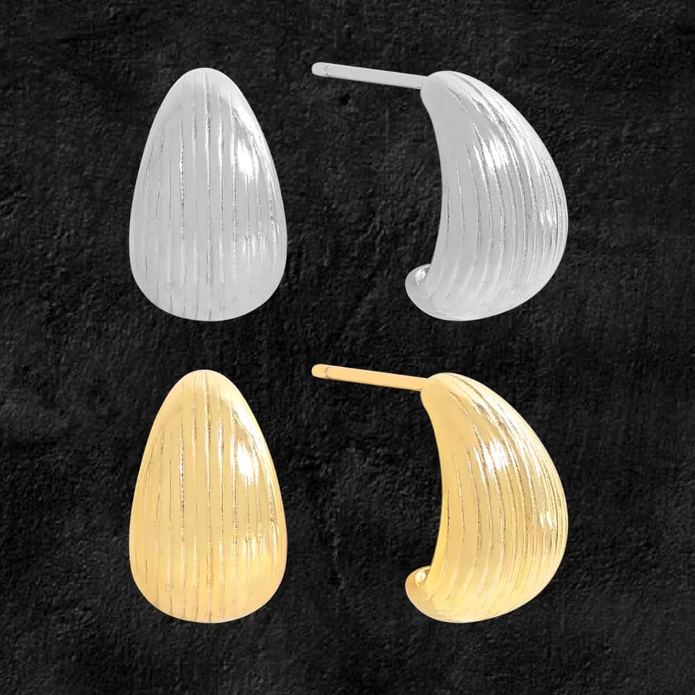 Polished textured teardrop stud earrings in silver and gold-tone finishes shown on a dark background.