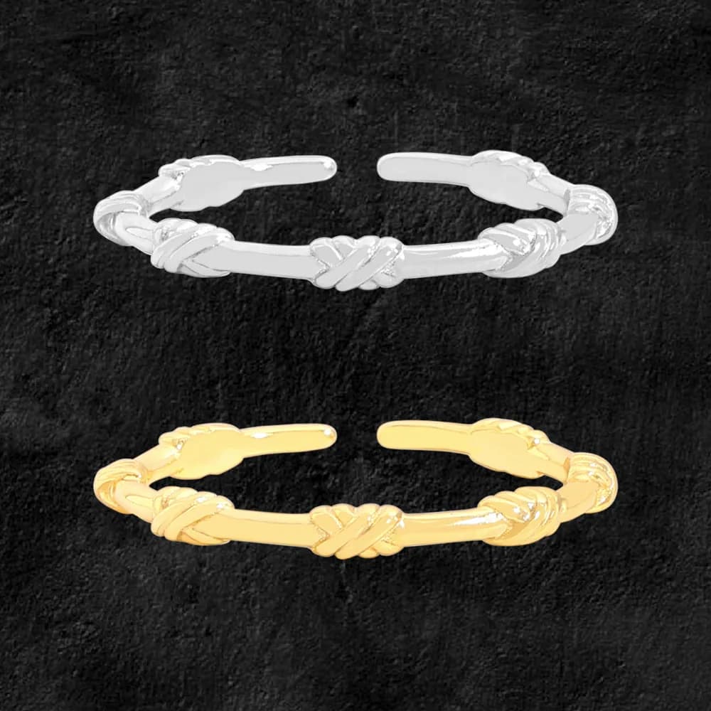 Open-end ring with a centered twisted knot on a polished silver band, shown in silver and gold tones.
