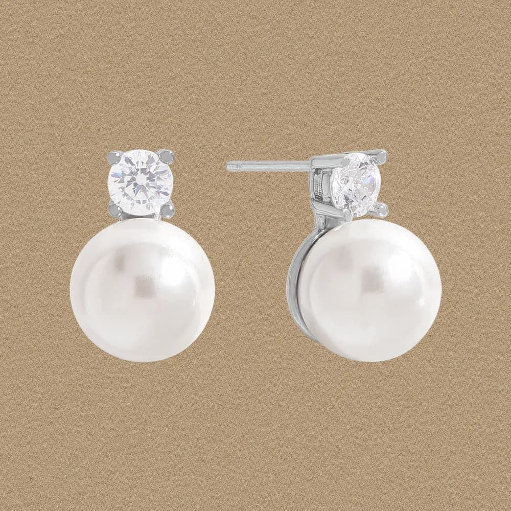 Sterling silver earrings with a round clear gemstone above a large white pearl drop.