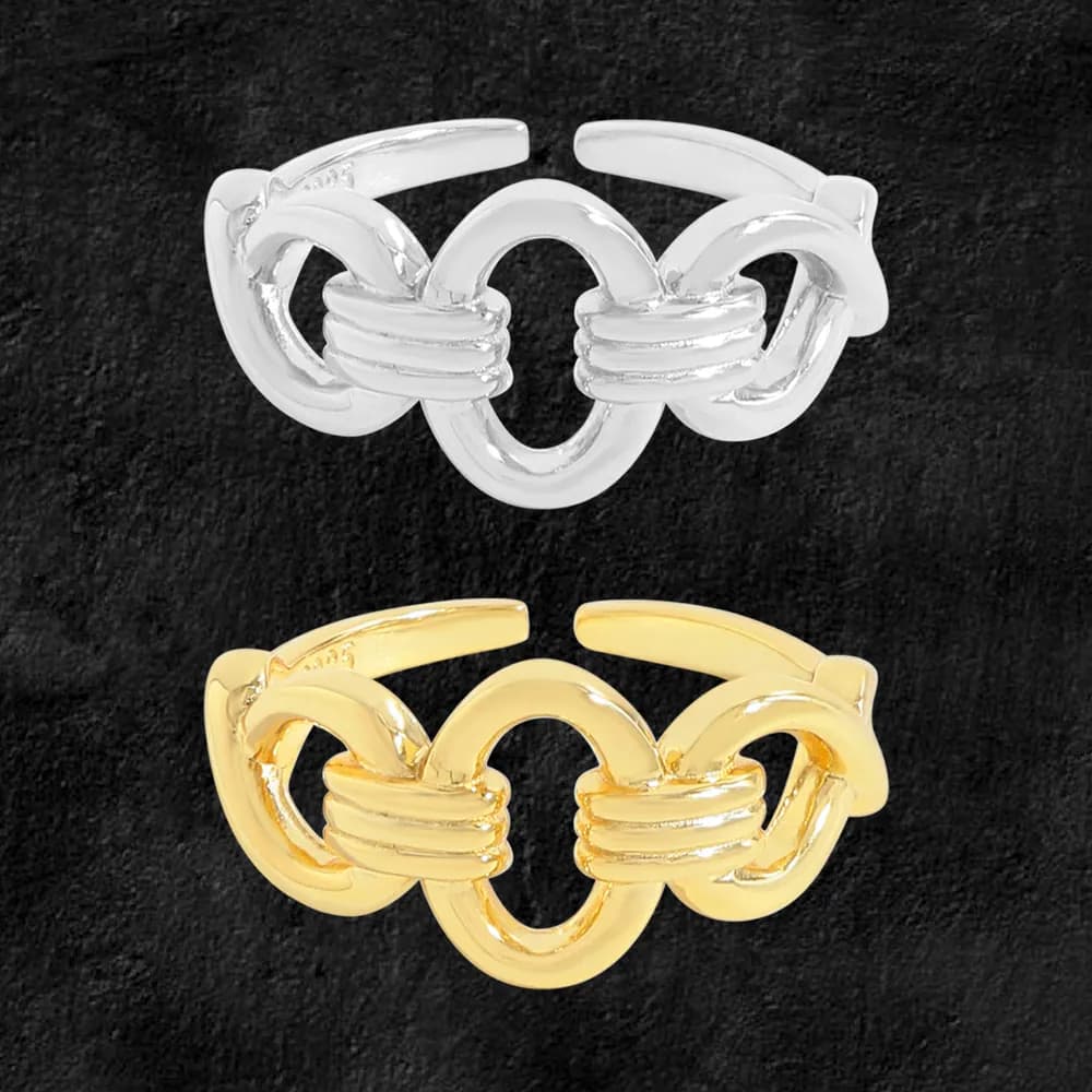 Polished sterling silver ring with interlocking circular links in a chain motif, shown in silver and gold-tone finishes.