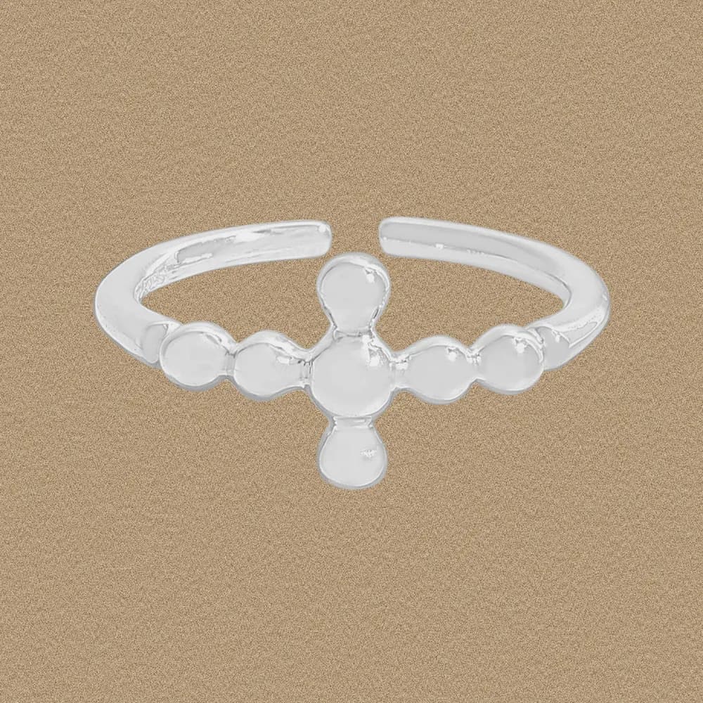 A sterling silver ring with a cross-shaped cluster of polished beads centered on a slim band.
