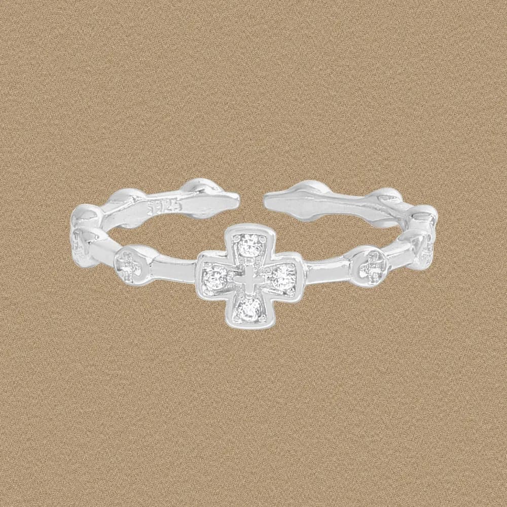 Polished sterling silver ring with a cross-shaped pavé centerpiece and linked bead-style band.