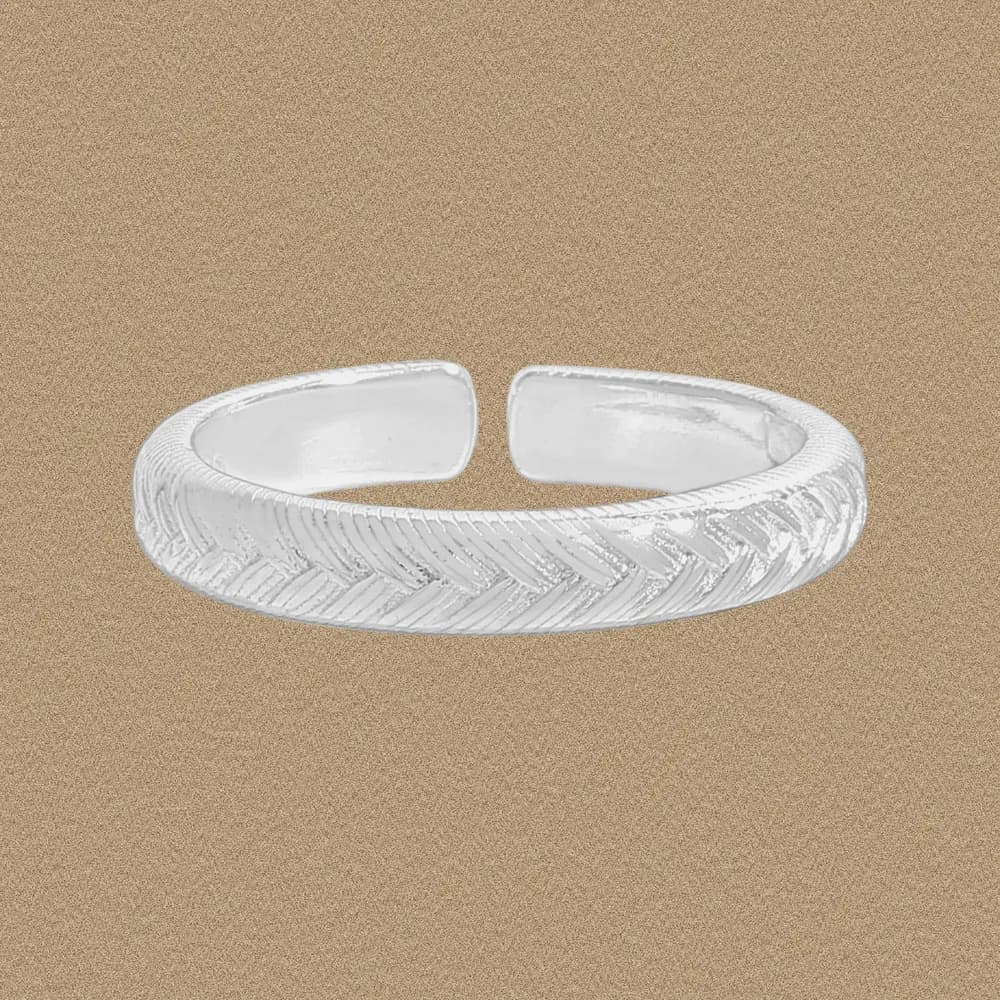 Polished sterling silver open-ended ring with a herringbone pattern around the band.