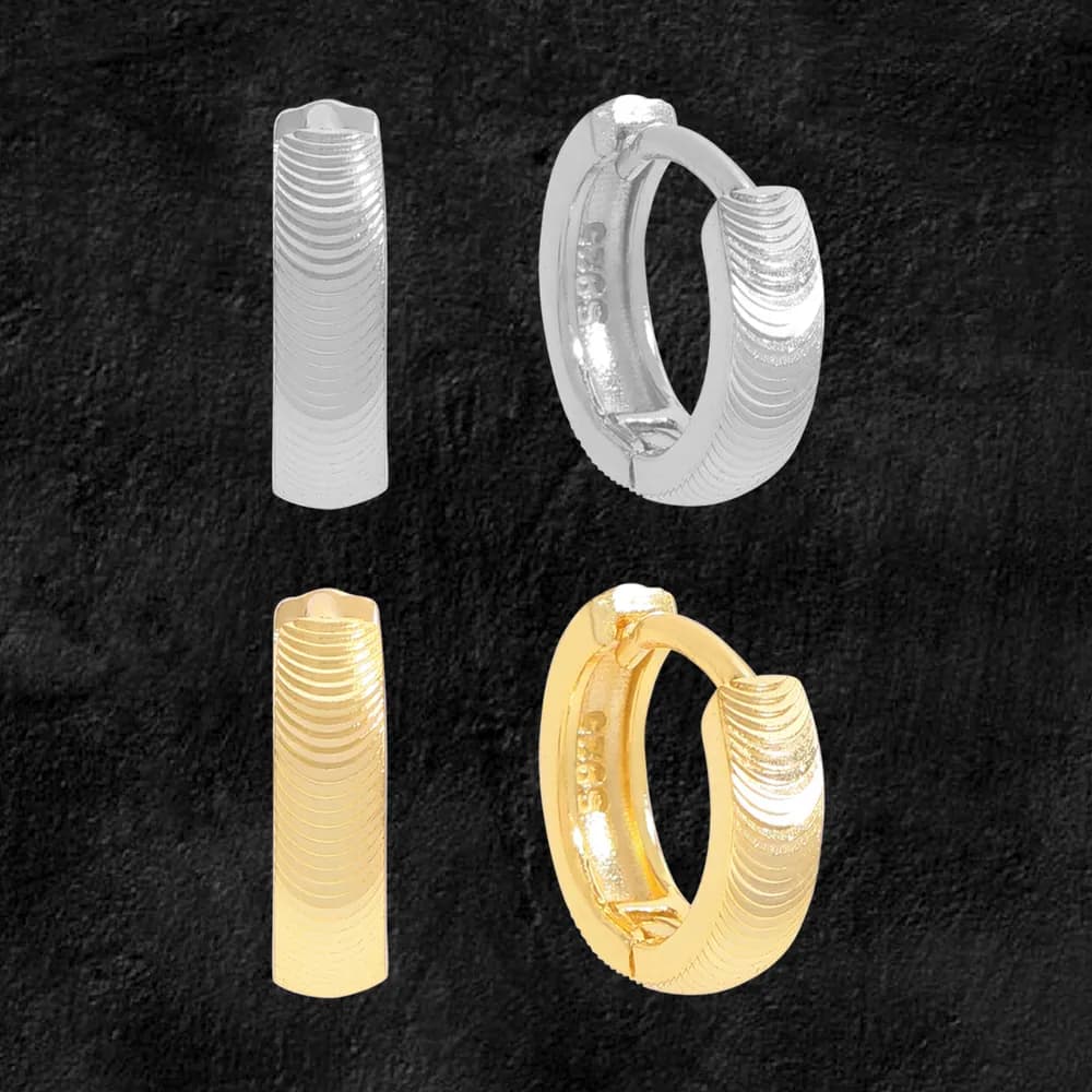 Polished ribbed hoop earrings in silver and gold-tone finishing with hinge clasps