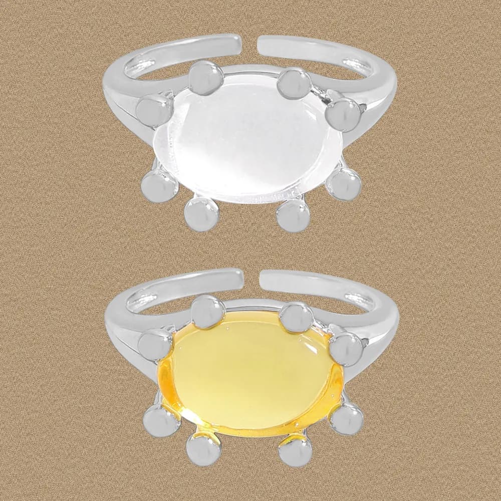 Polished silver Beaded Halo Ring with round central stone and bead accents on an open band.