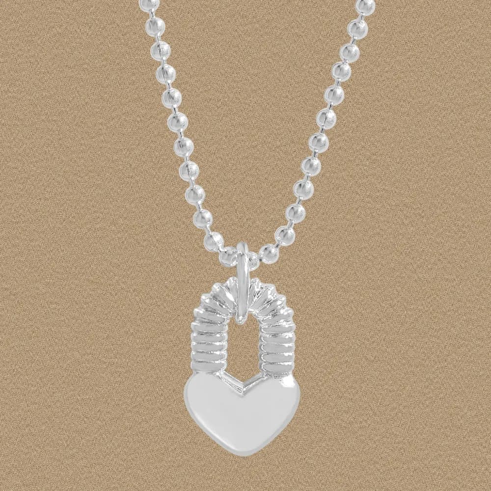 Sterling silver ball-chain necklace with a ribbed padlock-style heart pendant.