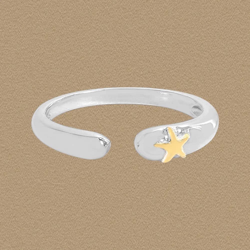 Polished sterling silver open ring with a gold-tone star accent on one end